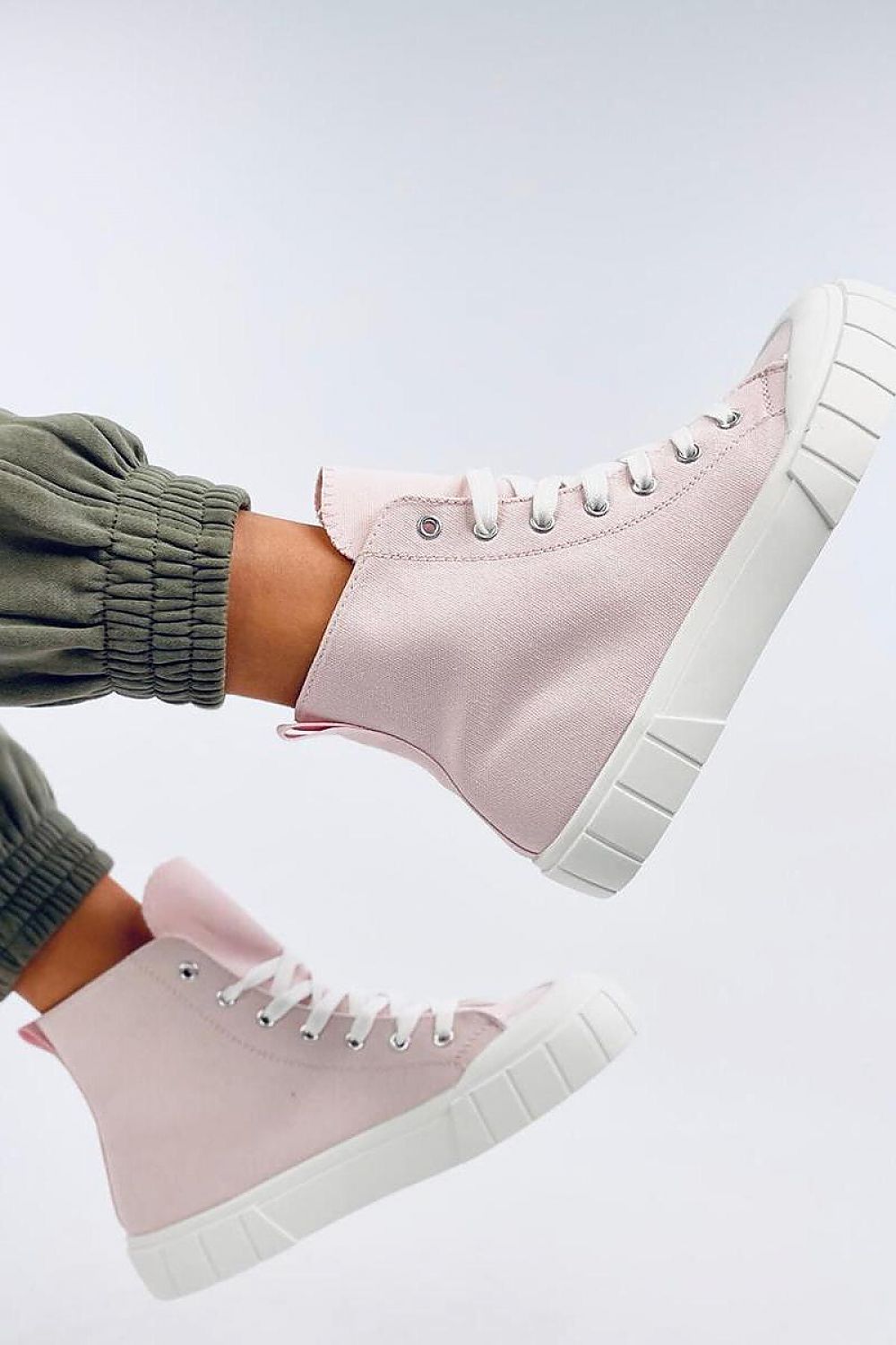 On-trend pink women's canvas ankle sneakers featuring a classic cut and a bold white thick sole. Made from fabric for both the outer and inner material, these sneakers are a must-have for those who love unique and fashionable styles. Perfect for making a statement this season.






