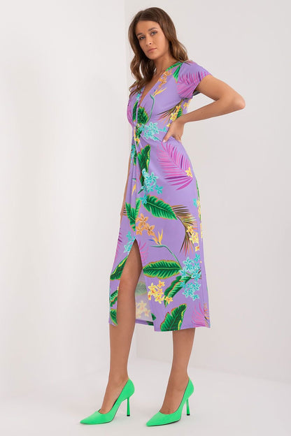 This vibrant pencil midi dress combines a bold, colorful print with an elegant cut, perfect for adding energy and charm to everyday styling. The striking front crease adds a subtle touch of femininity, while concealing imperfections. The heart neckline and short sleeves highlight the delicacy of the silhouette, enhancing the dress's elegance. The midi length offers versatility, suitable for both casual and formal occasions. 