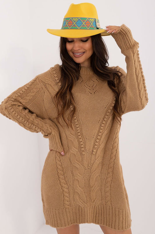 Comfortable long women's sweater made of soft acrylic with a textured knit, featuring a classic round neckline, perfect for everyday wear and work during colder days.






