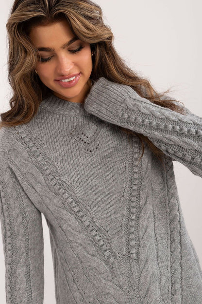 Comfortable long women's sweater made of soft acrylic with a textured knit, featuring a classic round neckline, perfect for everyday wear and work during colder days.






