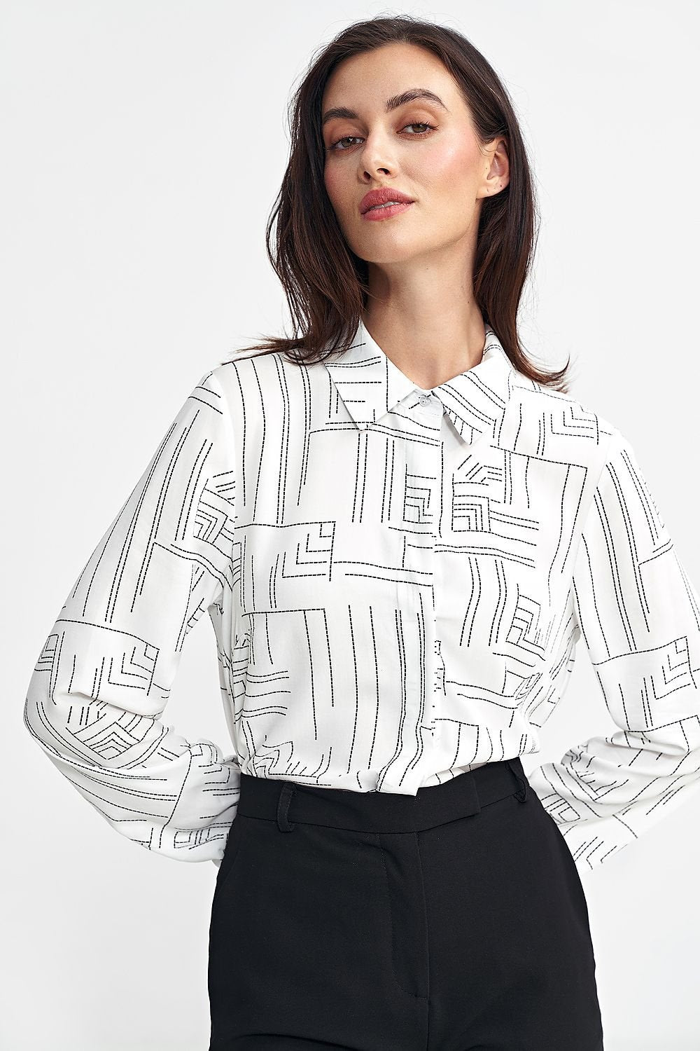 Women's regular-fit shirt made from high-quality viscose, featuring a minimalist geometric pattern, classic collar, long sleeves with cuffs, and a discreet button-up front hidden under a pleat. Perfect for both casual and formal occasions.