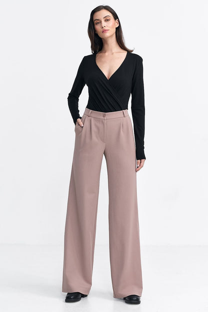 Elegant women's relaxed fit pants with subtly contrasting tennis-type stripes, offering a sophisticated touch. Featuring a medium rise, decorative front pleats for structure, and a wide leg cut for a fashionable casual look. Includes zipper and button closure, front pockets, imitation back pockets, and belt loops for customization.

