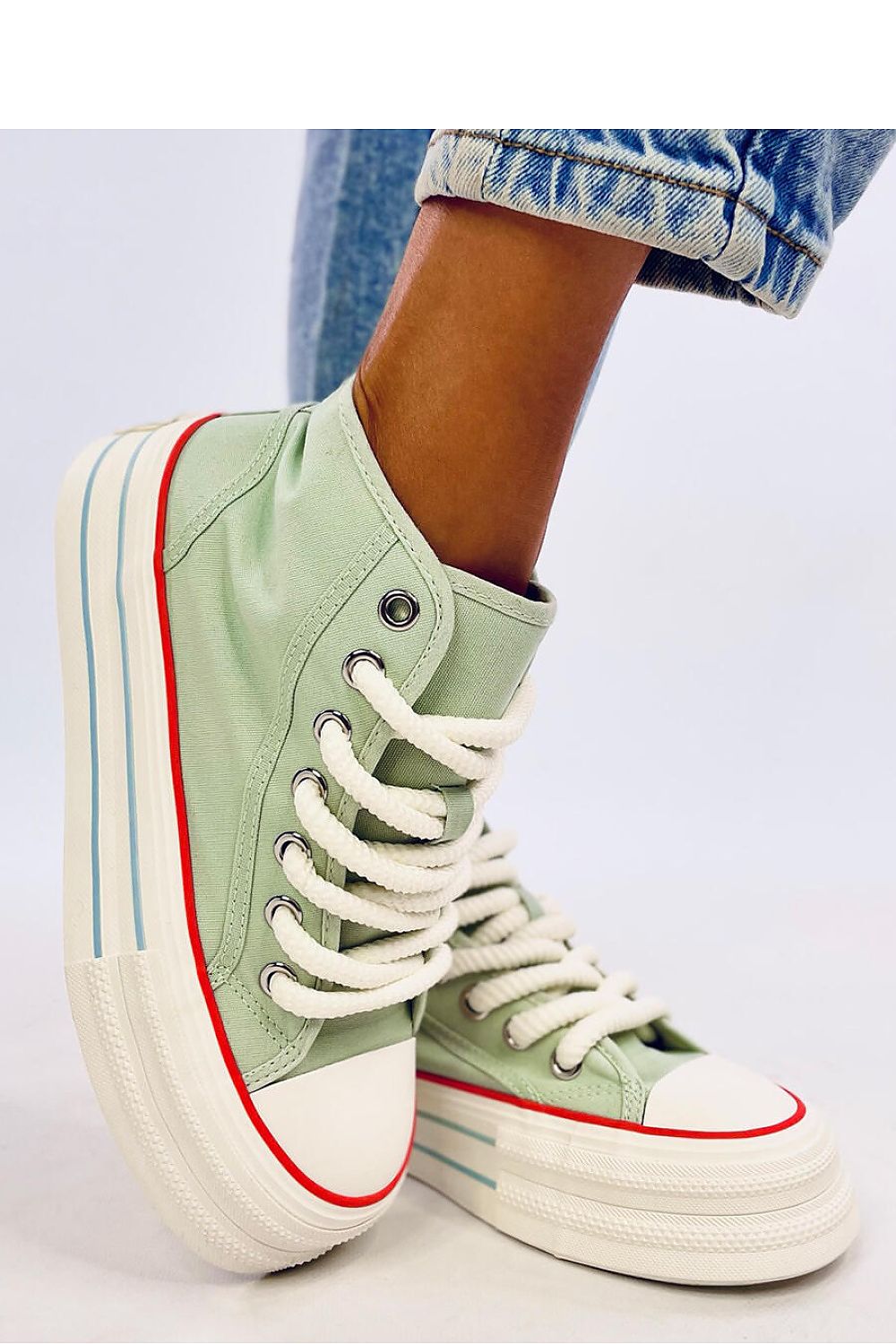 Eye-catching green women's ankle sneakers on a platform with thick laces and a high sole. Made from fabric for both outer and inner materials, these sneakers combine comfort and style. Perfect for those looking to make a bold, fashionable statement.






