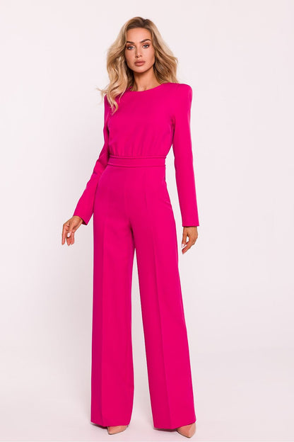 Sophisticated women's jumpsuit featuring a fitted top with long sleeves, shoulder pads, slightly wide-leg pants, and a decorative back zipper, crafted in Poland for a modern and elegant look.






