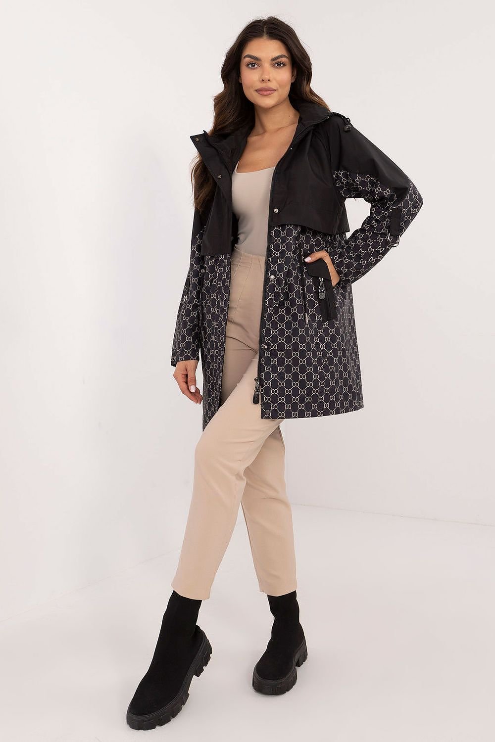 A stylish women's transitional jacket in a casual style, featuring a unique print and made of durable polyester. Designed for the autumn-winter season, it includes a hood for protection from cold and rain, a zipper closure with additional snaps for wind protection, and zippered slip pockets for secure storage. Uninsulated and lined for comfort, this jacket is a practical and fashionable choice for the transitional period.






