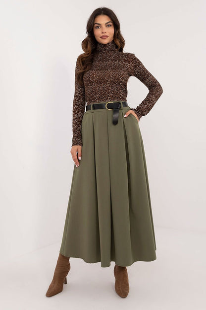 An elegant flared maxi skirt with a buckled belt, slip pockets, and a smooth pattern. Ideal for everyday wear, work, and formal occasions.

