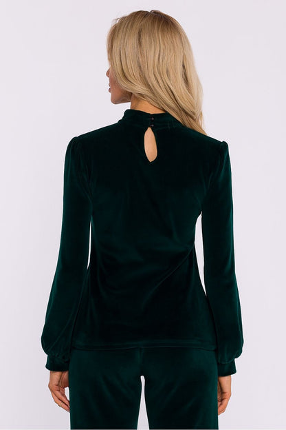 An elegant blouse made of soft velour knit fabric with a halter neckline that exposes the shoulders. Features a button-fastened back, long wide sleeves with cuffs, and a sophisticated design, perfect for evening outings and stylish occasion