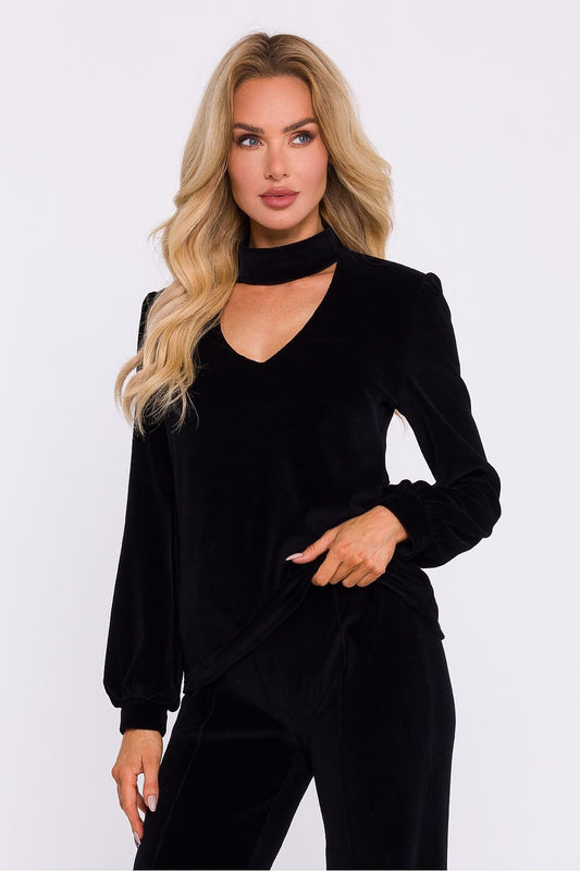 An elegant blouse made of soft velour knit fabric with a halter neckline that exposes the shoulders. Features a button-fastened back, long wide sleeves with cuffs, and a sophisticated design, perfect for evening outings and stylish occasion