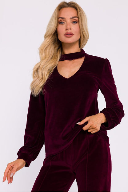 An elegant blouse made of soft velour knit fabric with a halter neckline that exposes the shoulders. Features a button-fastened back, long wide sleeves with cuffs, and a sophisticated design, perfect for evening outings and stylish occasion