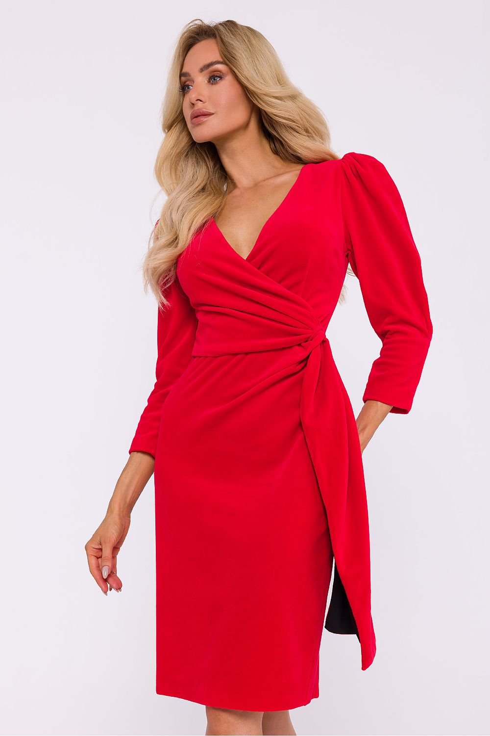 An elegant velour knit dress featuring an envelope cut top, decorative sash, knee-length pencil bottom with a high back slit, 7/8 sleeves with shoulder creases, and a concealed side zipper, perfect for special occasions. Designed and sewn in Poland.






