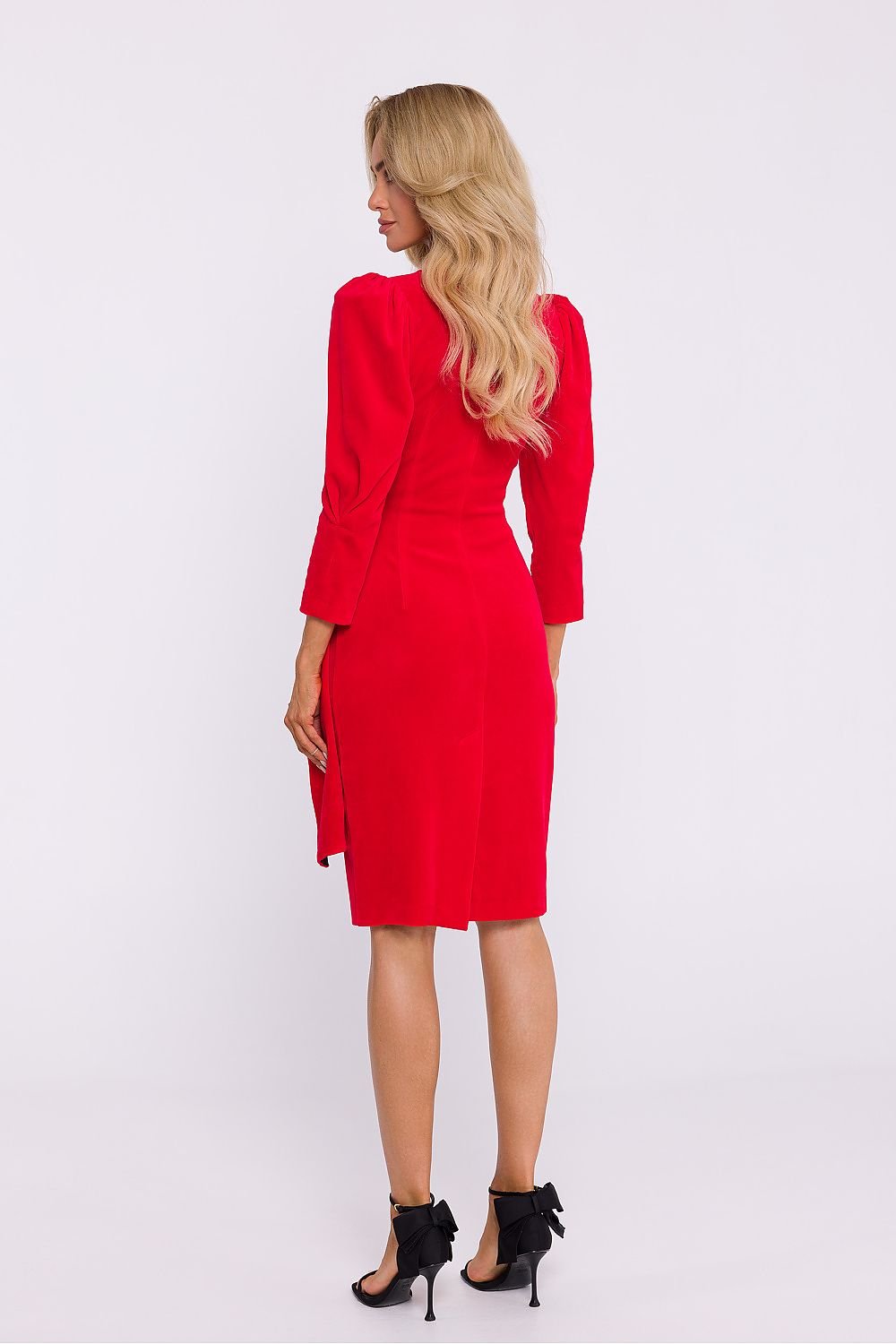 An elegant velour knit dress featuring an envelope cut top, decorative sash, knee-length pencil bottom with a high back slit, 7/8 sleeves with shoulder creases, and a concealed side zipper, perfect for special occasions. Designed and sewn in Poland.






