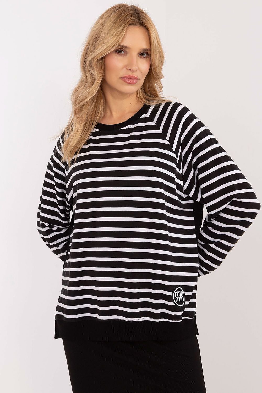 Striped blouse made of soft micro modal and elastane blend, featuring long sleeves, round neckline, side slits, and a small patch detail for everyday comfort and style.