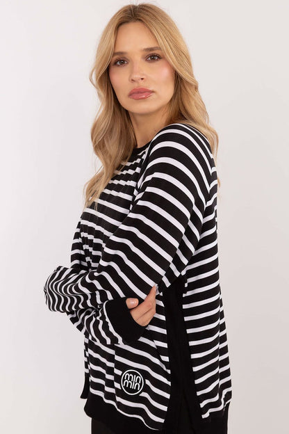 Striped blouse made of soft micro modal and elastane blend, featuring long sleeves, round neckline, side slits, and a small patch detail for everyday comfort and style.