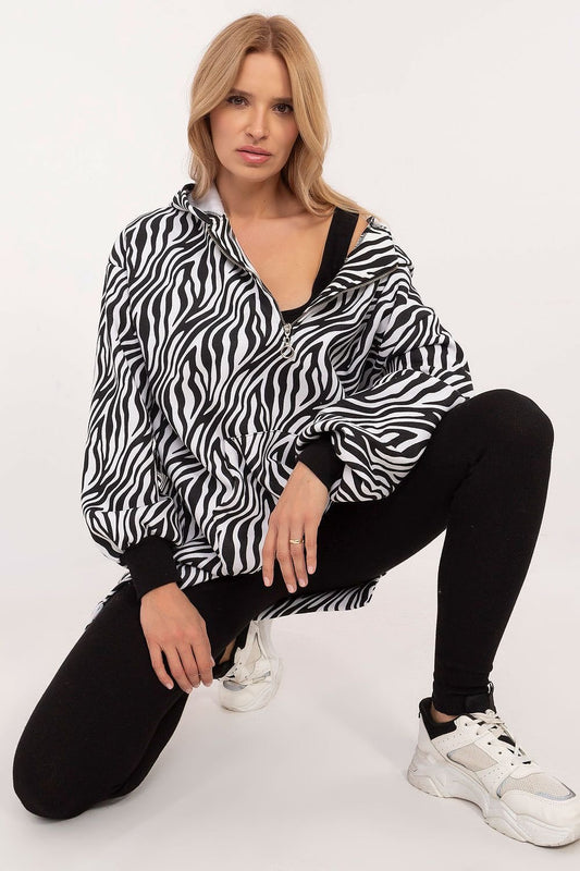 A women's casual set featuring a zebra print sweatshirt with a hood and kangaroo pocket, paired with a classic top and high-rise leggings, combining style and comfort for everyday wear.