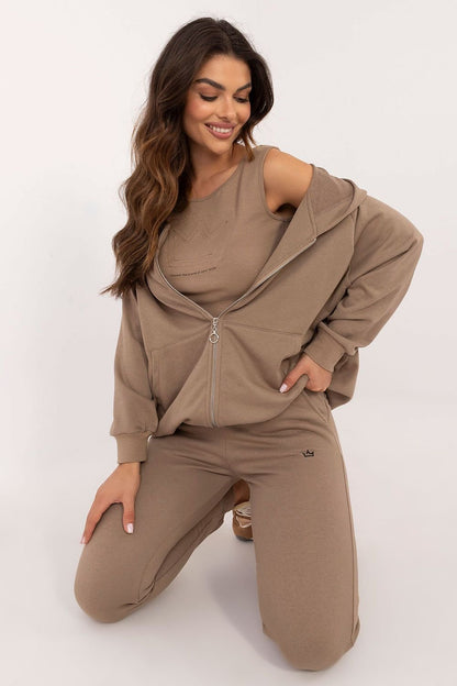 A versatile women's set featuring a T-shirt with a round neckline, a zippered sweatshirt with a hood and slip-in pockets, and high-waisted pants with ribbed cuffs and side slip pockets, offering comfort and style for casual outings and sports activities.