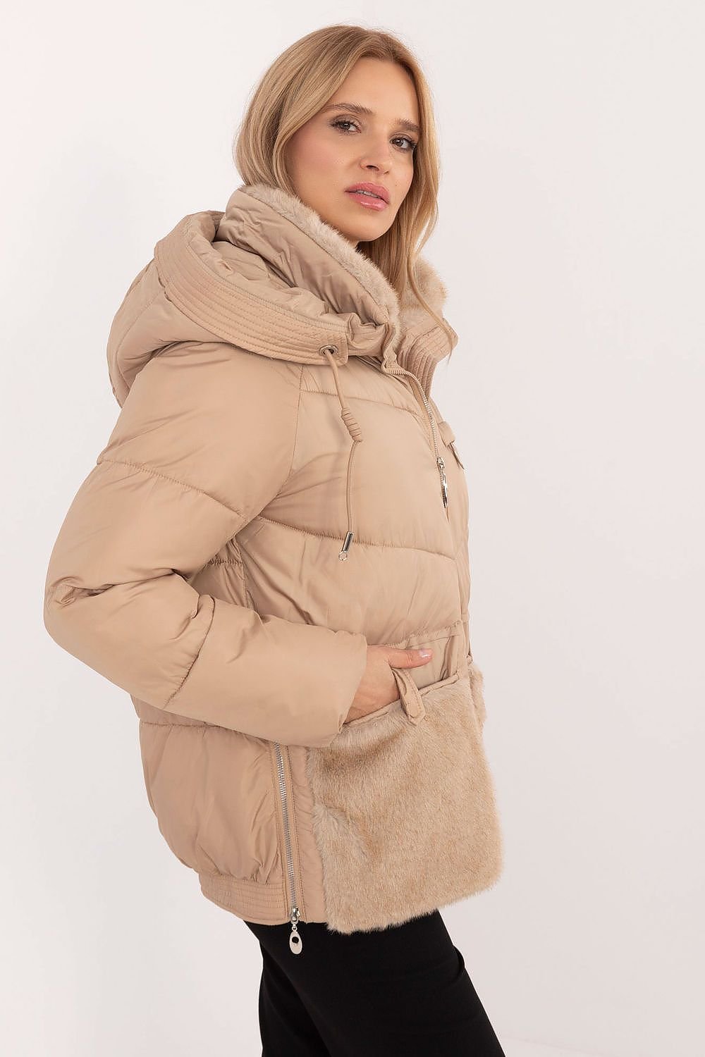 A cozy women's casual quilted jacket made from high-quality polyester, featuring synthetic insulation for warmth and comfort. Equipped with a practical hood, zipper closure with snaps, and slide-in pockets, this standard-length jacket offers protection against cold weather while ensuring style and functionality for autumn and winter outings.