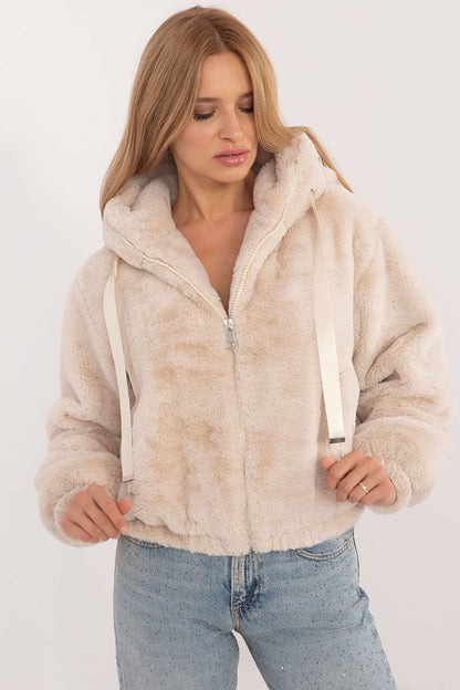 A cozy women's casual fur jacket made of soft viscose, designed for everyday outings and work in the autumn/winter season. Featuring a zippered closure, slip pockets, long sleeves, and a hood for wind protection, this standard-length jacket combines comfort, style, and practicality for transitional weather.






