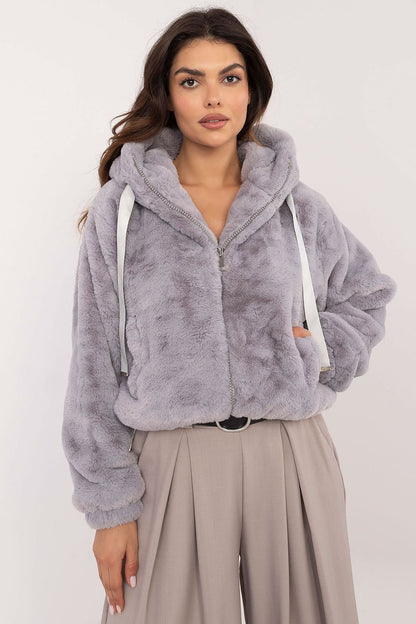 A cozy women's casual fur jacket made of soft viscose, designed for everyday outings and work in the autumn/winter season. Featuring a zippered closure, slip pockets, long sleeves, and a hood for wind protection, this standard-length jacket combines comfort, style, and practicality for transitional weather.






