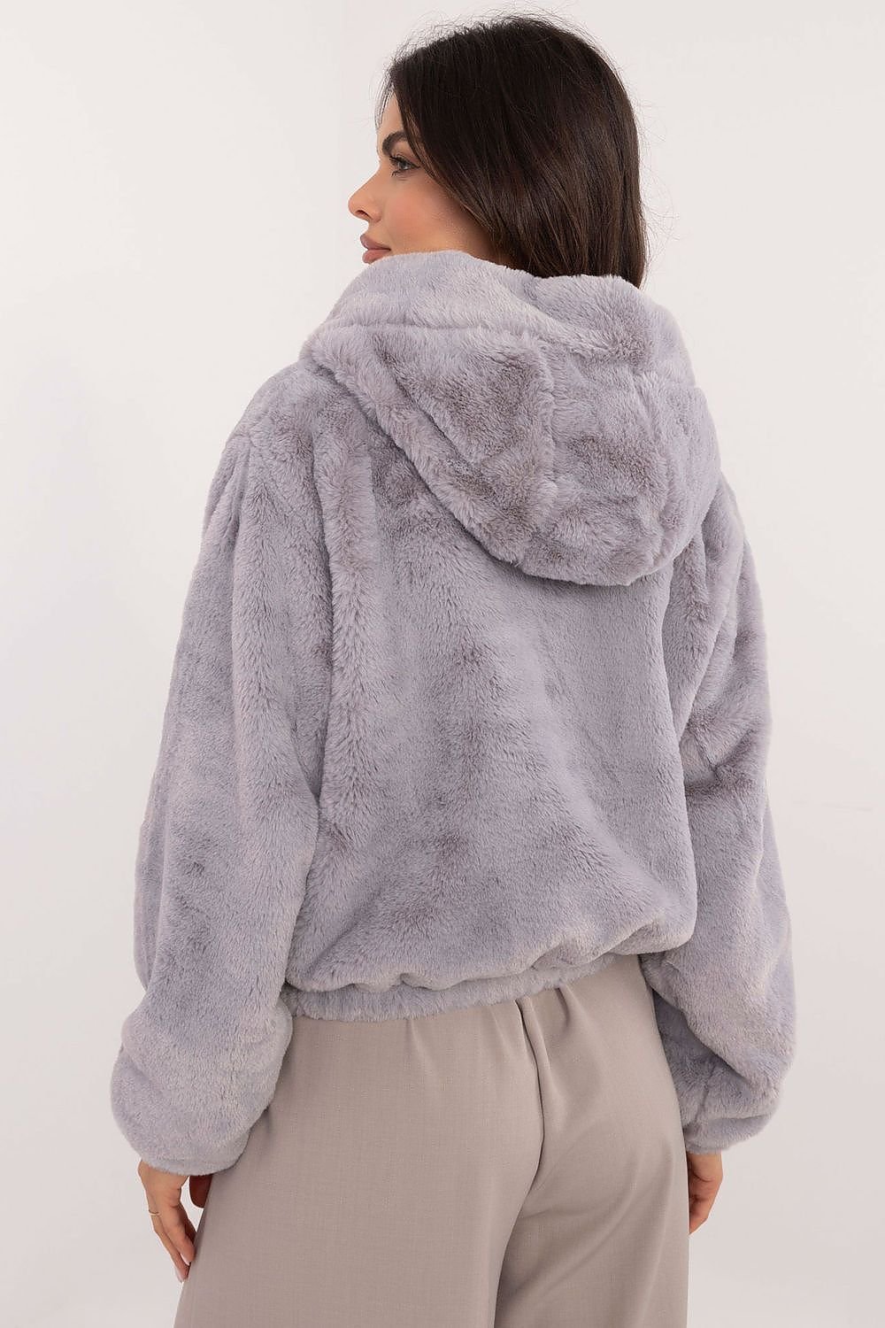 A cozy women's casual fur jacket made of soft viscose, designed for everyday outings and work in the autumn/winter season. Featuring a zippered closure, slip pockets, long sleeves, and a hood for wind protection, this standard-length jacket combines comfort, style, and practicality for transitional weather.






