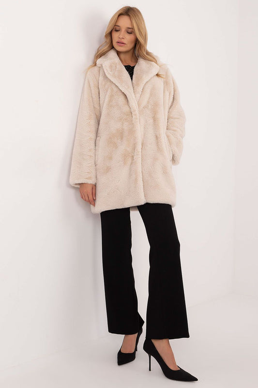 Transitional knee-length women's coat with snap fastening, long sleeves, slip pockets, and lining, ideal for autumn and winter.






