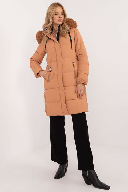 A cozy quilted winter jacket with an extended cut, featuring a smooth pattern, polyester fabric, and synthetic fill for warmth. The detachable hood and fur add style and versatility, while slip pockets, a zipper closure, and additional snaps offer comfort and protection from the cold. Perfect for everyday outings and work during the autumn/winter season.






