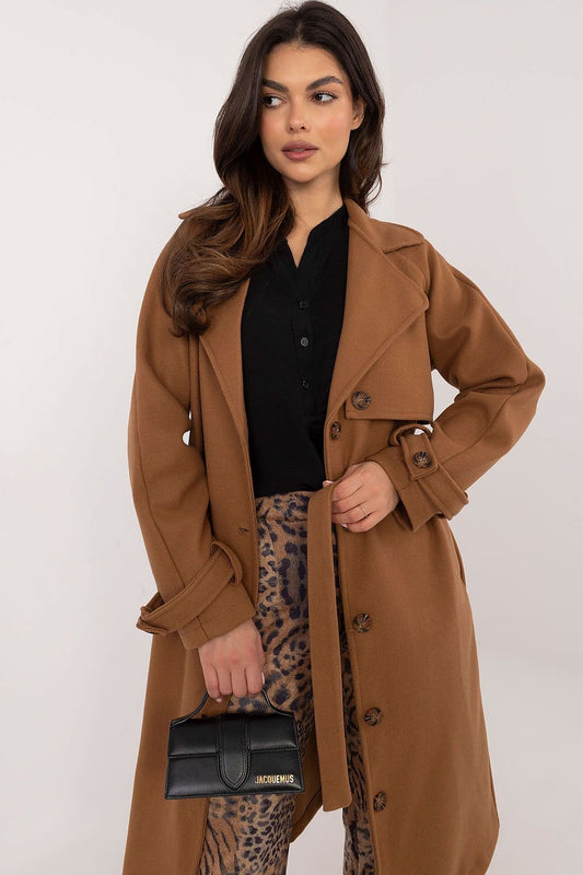 Timeless polyester trench coat with button closure, long sleeves, slip pockets, and a waist-accentuating belt. Perfect for versatile outfits.






