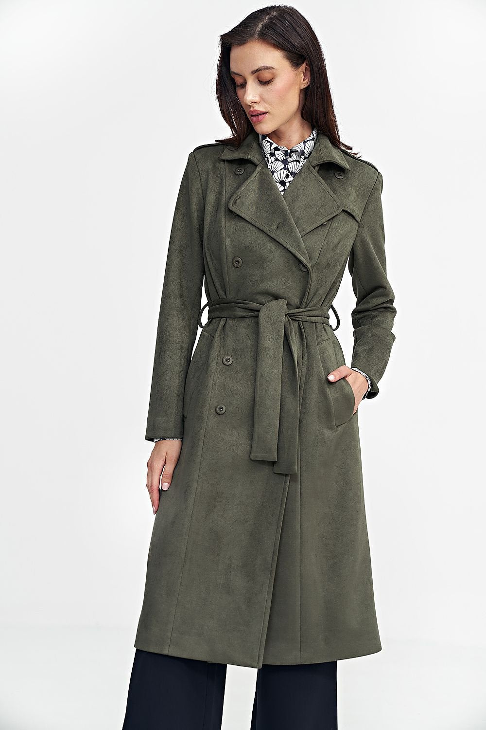 This elegant coat combines timeless style with exceptional comfort. Crafted from soft, nubuck-like material, it provides warmth and coziness on chilly days. Featuring a classic cut, long sleeves, and button closure, this versatile piece is perfect for any occasion. Decorative shoulder epaulettes with button accents add a subtle military-inspired flair, while the over-the-knee length and a matching belt accentuate your waist, creating a flattering silhouette. The fully lined interior offers additional therma