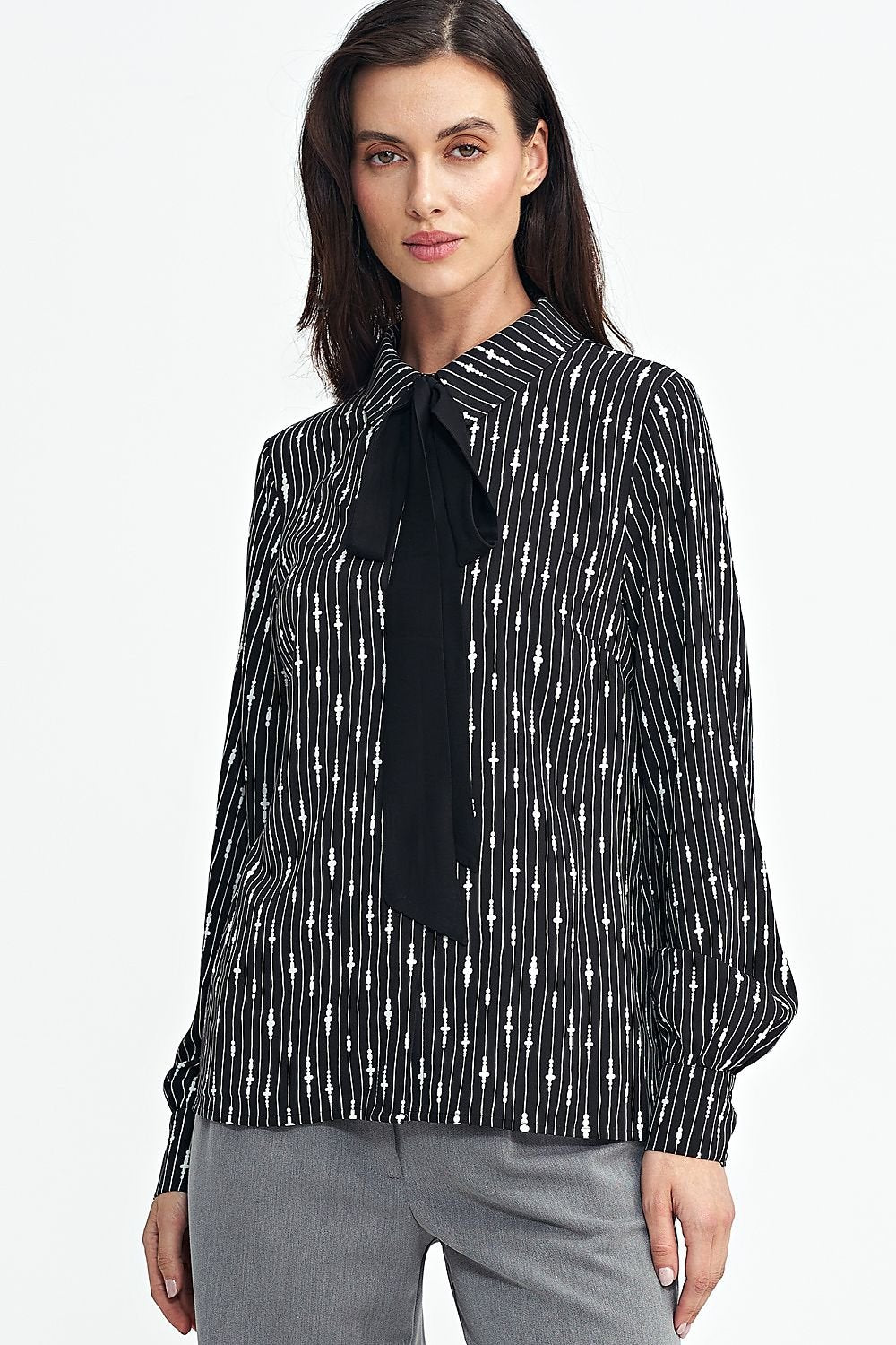 Elegant viscose shirt with a unique pattern, classic collar, black sash tie, long sleeves with cuffs, and front button closure. Comfortable and stylish, perfect for women who appreciate individuality.