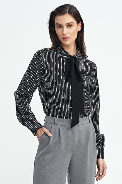 Elegant viscose shirt with a unique pattern, classic collar, black sash tie, long sleeves with cuffs, and front button closure. Comfortable and stylish, perfect for women who appreciate individuality.