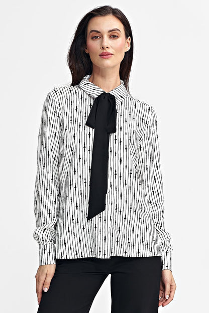 Elegant viscose shirt with a unique pattern, classic collar, black sash tie, long sleeves with cuffs, and front button closure. Comfortable and stylish, perfect for women who appreciate individuality.