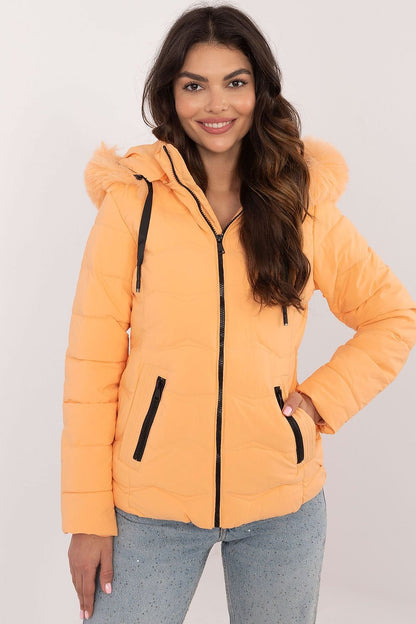 A stylish, high-quality quilted jacket made from polyester and filled with synthetic down for warmth and comfort. Featuring a short length, zipper closure, and detachable hood with drawstring closure, it provides protection from wind and rain. Side zippered pockets offer practicality, while the universal plain pattern ensures versatility for various styles.