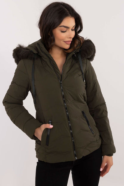 A stylish, high-quality quilted jacket made from polyester and filled with synthetic down for warmth and comfort. Featuring a short length, zipper closure, and detachable hood with drawstring closure, it provides protection from wind and rain. Side zippered pockets offer practicality, while the universal plain pattern ensures versatility for various styles.