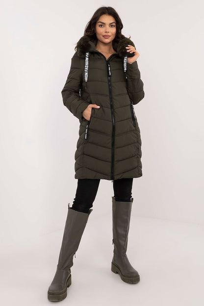 A stylish knee-length quilted jacket made of high-quality polyester with synthetic down filling for warmth. Featuring detachable fur for adaptable styling, an adjustable hood for wind and rain protection, side zippered pockets for secure storage, and a zipper closure for comfort. Its versatile design pairs easily with jeans or sports pants, making it a perfect choice for colder days.






