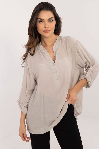 Soft viscose and nylon blend blouse with long roll-up sleeves, V-neck with stand-up collar, and adjustable button closure for a stylish and comfortable fit.