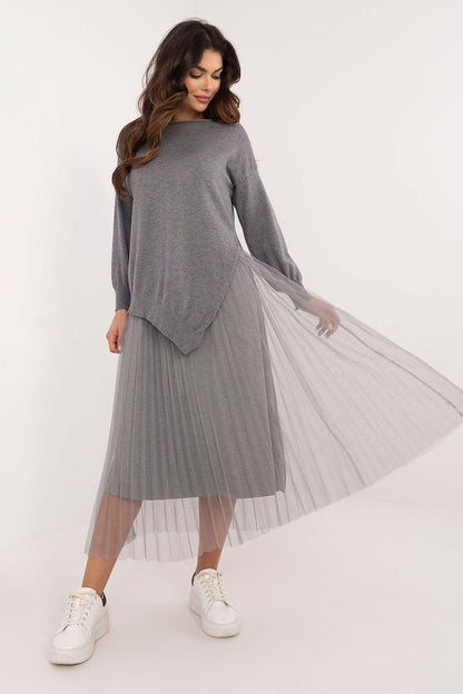 A sophisticated women's set featuring a midi-length lined dress and a matching long-sleeve sweater. Both pieces are crafted from a high-quality viscose blend for comfort and an elegant look. The smooth texture and round neckline create a timeless and cohesive style, perfect for formal occasions, work, or refined everyday wear.






