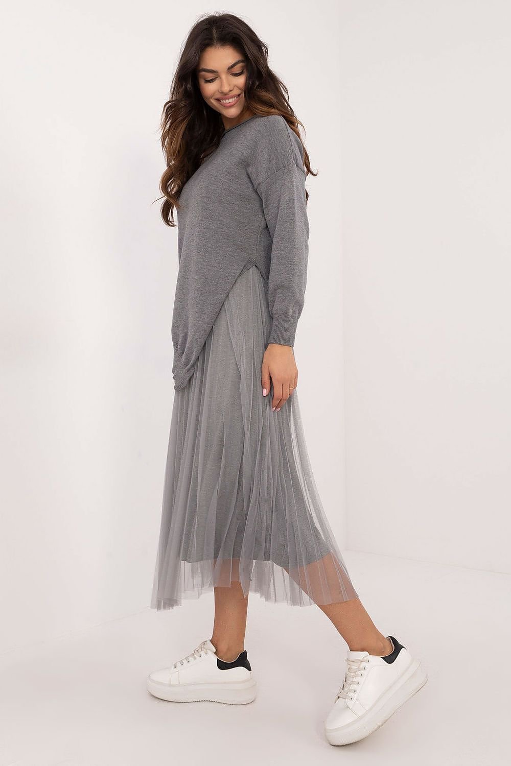 A sophisticated women's set featuring a midi-length lined dress and a matching long-sleeve sweater. Both pieces are crafted from a high-quality viscose blend for comfort and an elegant look. The smooth texture and round neckline create a timeless and cohesive style, perfect for formal occasions, work, or refined everyday wear.






