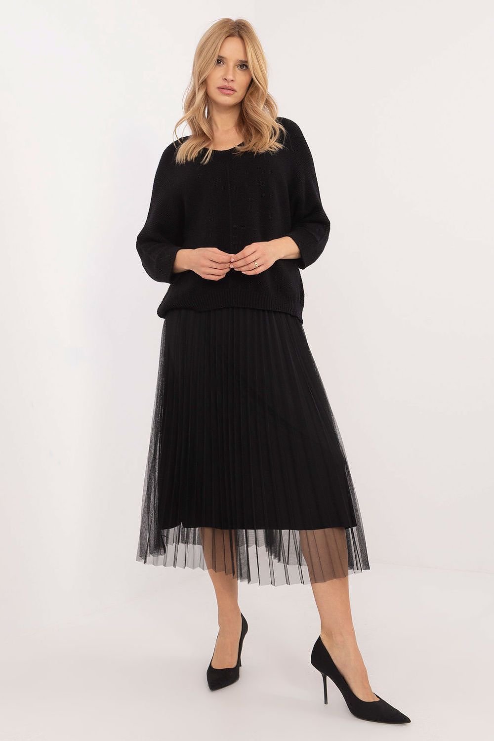 An elegant set featuring a midi-length dress with a textured fabric, lined for comfort and style, paired with a long-sleeve sweater with a subtle round neckline. Perfect for everyday wear, work, or formal occasions.






