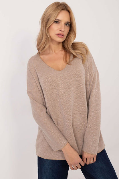 This elegant sweater combines everyday comfort with refined sophistication. Crafted from a blend of viscose and elastane, it offers exceptional comfort and flexibility while its shimmering thread adds a touch of glamour to your look. The textured fabric features a subtle pattern that enhances its modern, stylish appeal.

