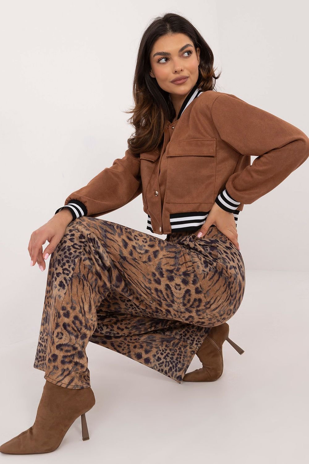 Elegant trousers with a bold leopard print, featuring a high waist and straight legs for a flattering silhouette. Crafted from a comfortable cotton blend, they include a button and zipper fastening with side slip pockets, adding both style and functionality to your wardrobe. Perfect for casual or office wear.






