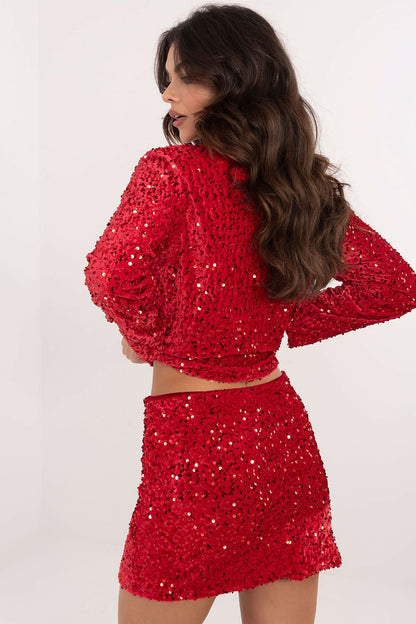 A glittering sequin mini skirt with a polyester-viscose blend, subtle lining, and a zipper for easy wear. Perfect for parties and formal events.

