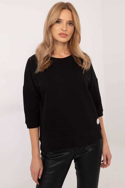 Soft and breathable cotton blouse with 3/4 sleeves, round neckline, and minimalist smooth pattern, perfect for everyday wear.