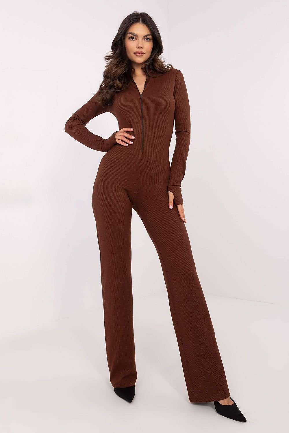 Comfortable women's jumpsuit made from a stretchy cotton blend with ribbed fabric, featuring a stand-up collar, thumb hole cuffs, and a functional zipper closure for a stylish, modern look.