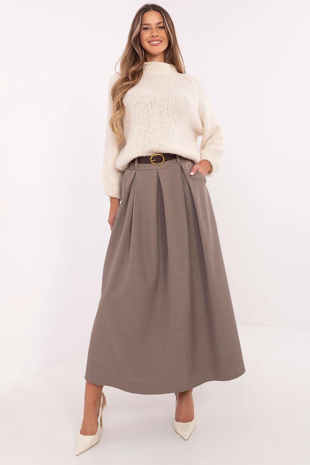 An elegant flared maxi skirt with a buckled belt, slip pockets, and a smooth pattern. Ideal for everyday wear, work, and formal occasions.

