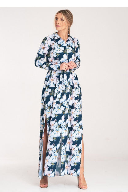 Stylish maxi dress with a narrow waist belt, side slits, and vibrant floral patterns.
