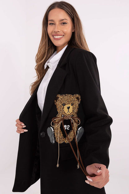 A versatile women's jacket made from a polyester and viscose blend, featuring sewn-in shoulder pads for added structure. With a button closure and long sleeves, it offers comfort and elegance for casual wear or work. The jacket's teddy bear-shaped patch adds a unique touch, while its mid-thigh length and lining provide warmth and comfort, making it perfect for autumn, winter, and spring.