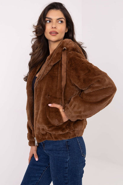 A chic teddy bear jacket with a soft polyester lining, featuring long sleeves, a practical hood, and a short, casual cut. Includes a zipper closure, adjustable waist ties for a flattering fit, and convenient slide-in pockets. Perfect for milder transitional weather, blending comfort and style effortlessly.






