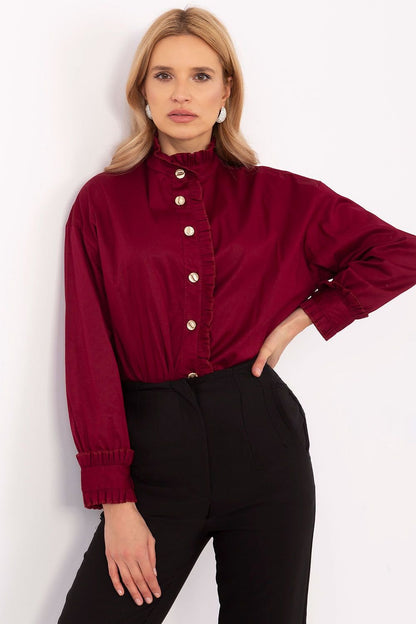 A refined women's red shirt made from high-quality cotton with a touch of elastane for comfort and a perfect fit. Featuring a subtle ruffle along the pleat for a unique charm, this classic buttoned shirt is perfect for formal occasions, special meetings, or everyday work outfits.






