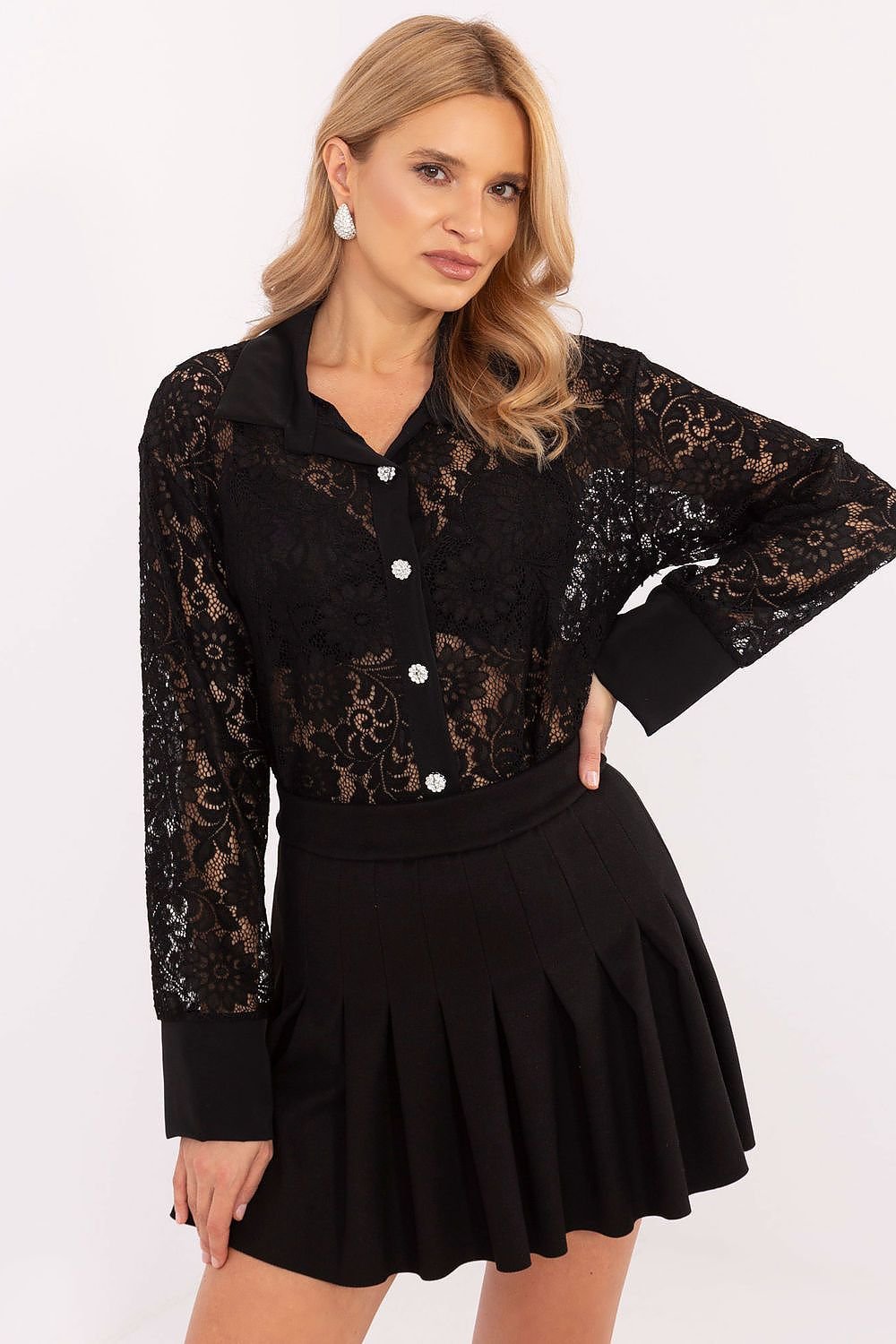 A delicate women's lace shirt made from a blend of polyester, elastane, and viscose, offering comfort and a feminine style. Featuring a lacy pattern, standard length, and button fastening, it is perfect for formal outfits, work meetings, or evening outings. A timeless piece with modern elegance.






