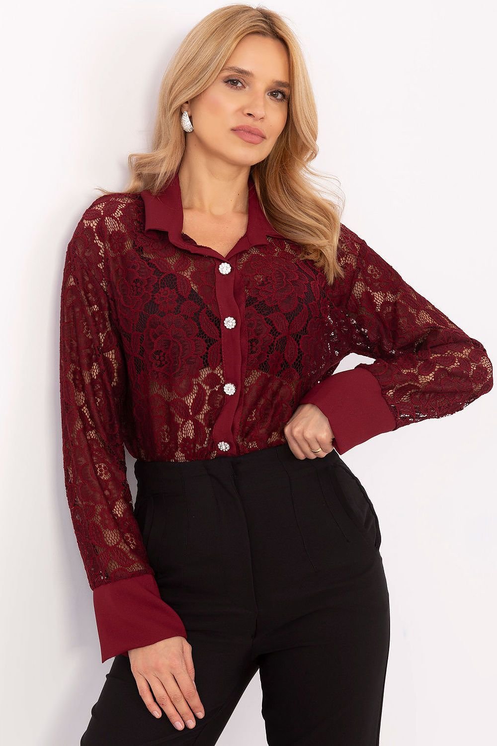 A delicate women's lace shirt made from a blend of polyester, elastane, and viscose, offering comfort and a feminine style. Featuring a lacy pattern, standard length, and button fastening, it is perfect for formal outfits, work meetings, or evening outings. A timeless piece with modern elegance.






