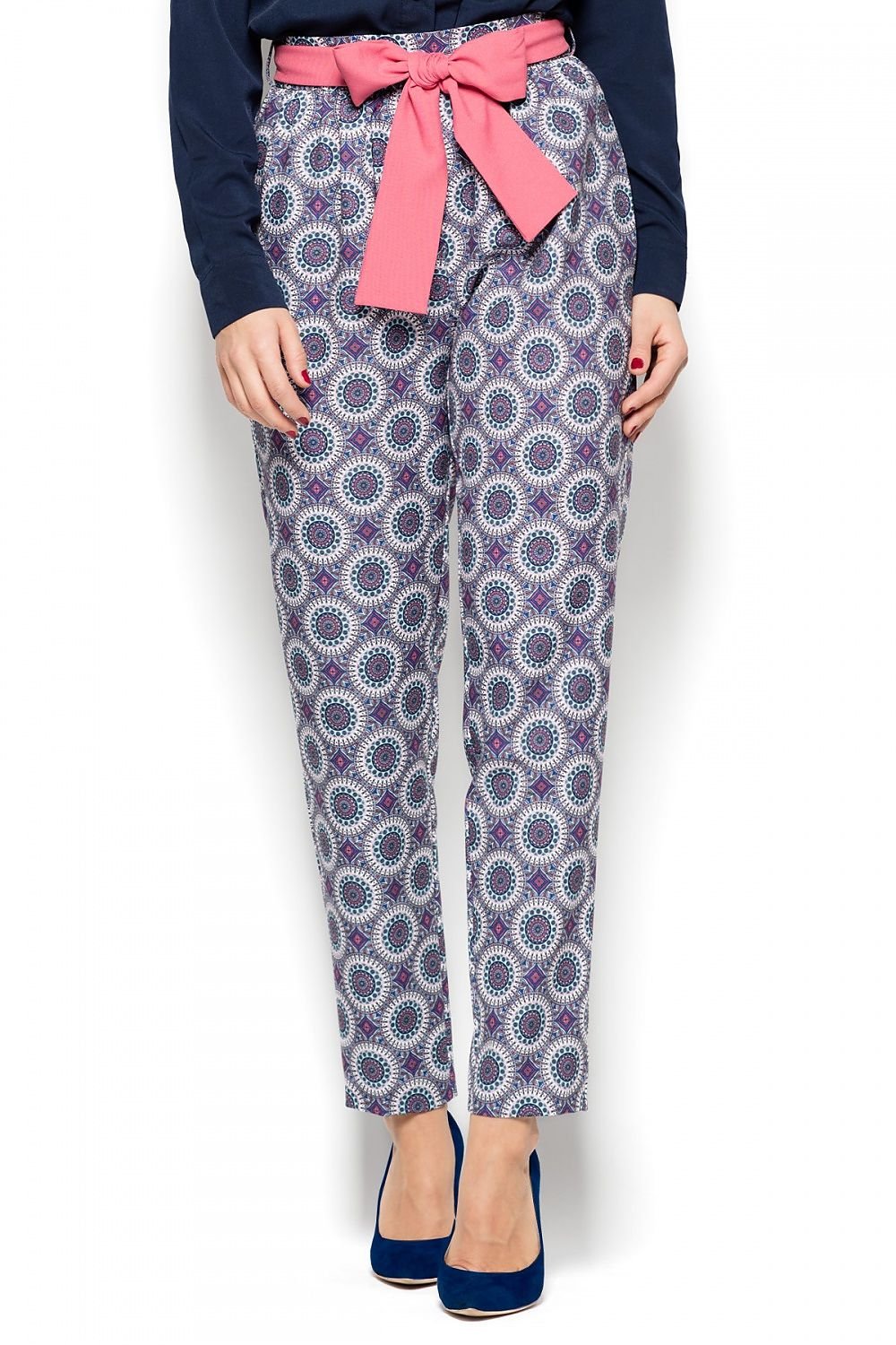 These classic trousers feature a flattering tapered silhouette that gives a modern edge to the timeless style. Designed with side pockets for functionality, they come with a beautiful, colorful tie at the waist, adding a touch of vibrancy. The trousers are completed with a concealed zipper at the back for a sleek, smooth finish.

